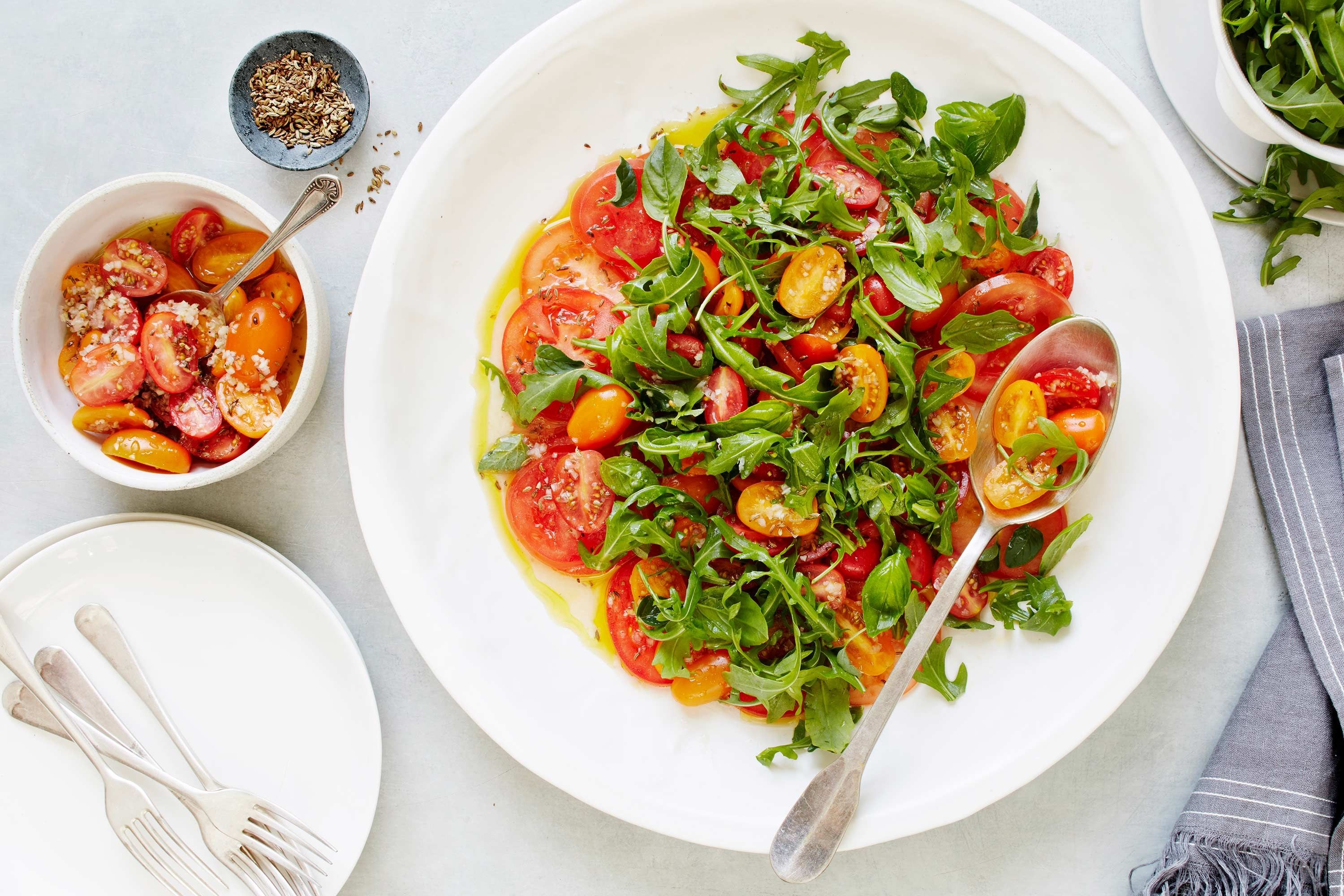 Tomato carpaccio salad with rocket and tomato-fennel seed vinaigrette