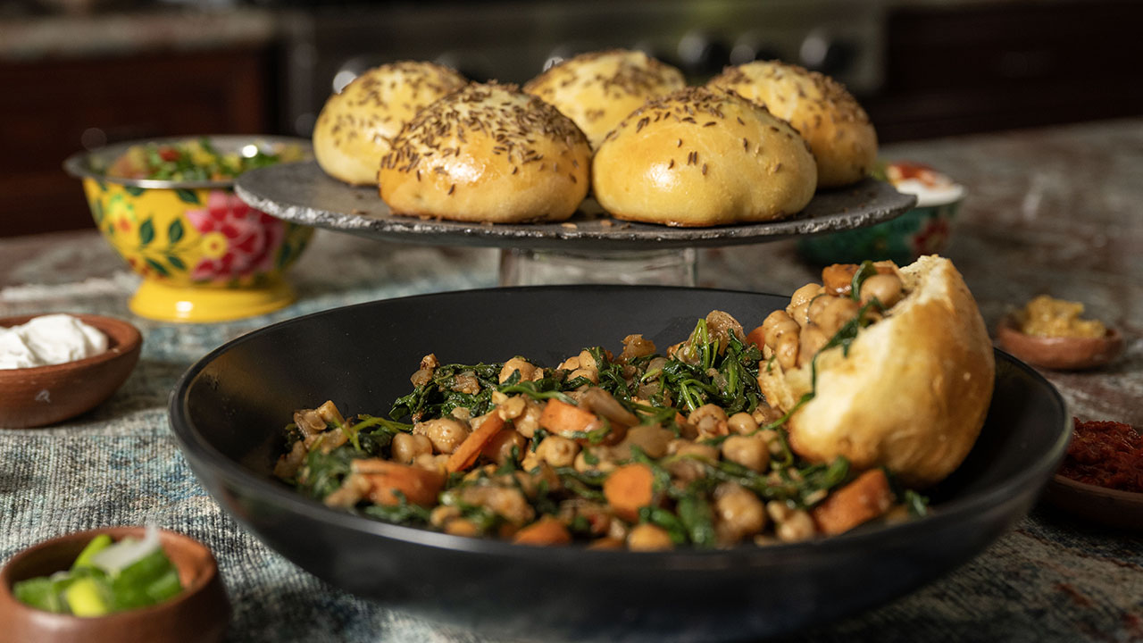 Serve this Tunisian-spiced chickpea stew with caraway challah