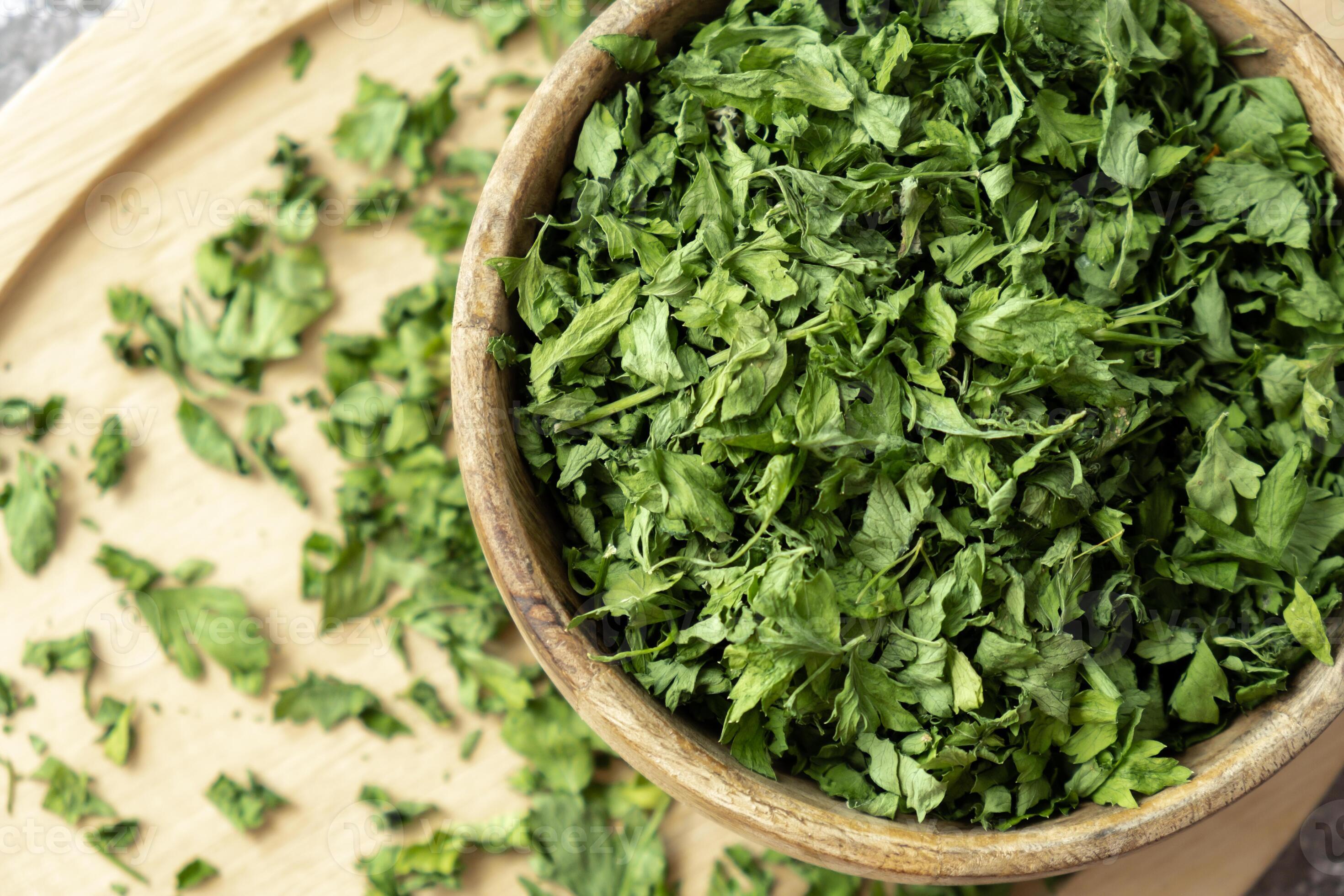 Dry parsley spice with wooden spoon in wooden bowl. Homegrown herbs and spices for cooking. Fresh dried aromatic natural food ingredients. Copy space 46740659 Stock Photo at Vecteezy